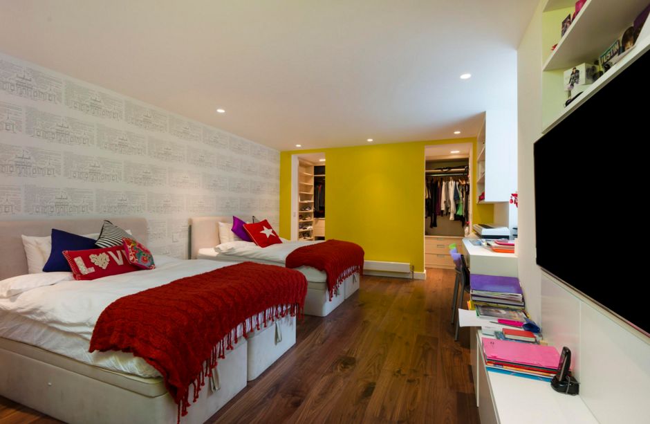 Large bedroom with two beds - yellow-mustard walls
