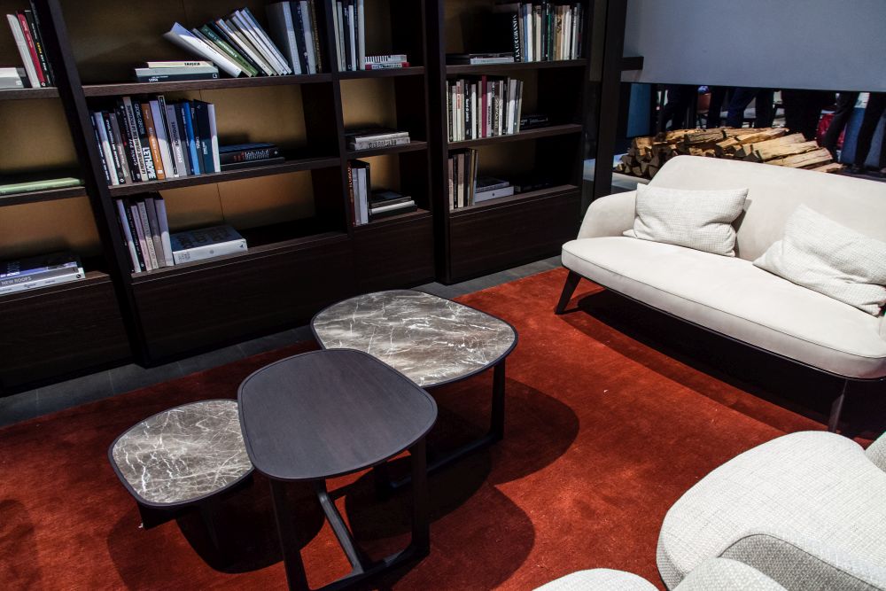 A living room can have more than one coffee table, especially one with more than one type of seating