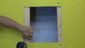 photo attaching wood framing for a drywall patch
