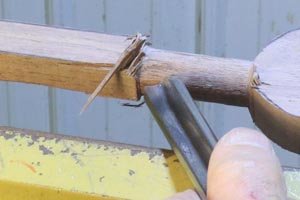 Turning handle on wooden spoon using a bowl gouge.