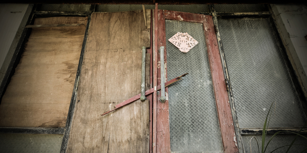 Door Locked With Wood Plank